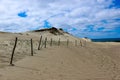 Beautiful endless sand dunes on the baltic sea coast under bright blue sky with clouds, Curonian Spit, Lithuania Royalty Free Stock Photo
