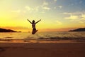 Beautiful energy young woman silhouette jumping on beautiful sun