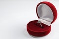 Beautiful engagement ring in red box on white background, space for text Royalty Free Stock Photo