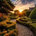 Beautiful English garden, with green hedges, at sunset