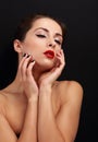 Beautiful enjoying makeup woman touching her health face skin Royalty Free Stock Photo