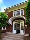 Beautiful entrance to a traditional American house on a sunny summer day