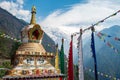 Beautiful Tibetan Buddhism stupa in Chhomrong village with Mt.Annapurna south in the background. Royalty Free Stock Photo