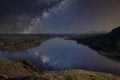 Beautiful epic digital composite landscape of Milky Way over Hallin Fell and Ullswater in Lake District Royalty Free Stock Photo
