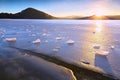 Beautiful epic ice crystal in the frozen bay. Sun rays reflection Royalty Free Stock Photo