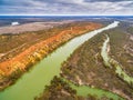 Orange sandstone cliffs looming over Murray RIver.