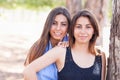 Beautiful Ethnic Twin Sisters Portrait Outdoors.