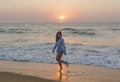 Beautiful european girl playing on the beach during sunset time Royalty Free Stock Photo