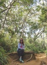 Beautiful european girl sitting in the tropical forest