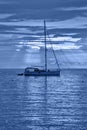 Beautiful evening Adriatic sea, yacht and full moon, Croatia. Evening toned in blue seascape Royalty Free Stock Photo