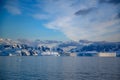 Antarctic landscape with snowcapped mountains, icebergs and glacier near Andvor Bay, Antactic Peninsular