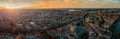 Beautiful evening panorama of Amstedam city looking towards the west with beautiful sunset and sun setting down over Amsterdam. Royalty Free Stock Photo