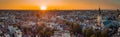 Beautiful evening panorama of Amstedam city looking towards the west with beautiful sunset and sun setting down over Amsterdam. Royalty Free Stock Photo