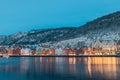 Beautiful evening panorama of Bergen waterfront, Bryggen area. Magical cityscape at night, visible colorful houses of Bergen. Long Royalty Free Stock Photo