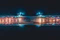 Beautiful evening scene with the famous Tower Bridge of St.Petersburg illuminated and reflected in Neva river