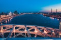 Beautiful evening scene with the famous Tower Bridge of St.Petersburg illuminated and reflected in Neva river