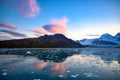 Foehn clouds - Lenticularis clouds - over mountains reflecting in ocean with ice floes, South Georgia Royalty Free Stock Photo