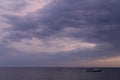 Beautiful evening sky with pink violet clouds. Seascape with clouds for background. Royalty Free Stock Photo