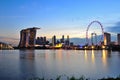 Beautiful evening skyline of Singapore business district area featuring Marina Bay Sands hotel and Singapore Flyer Royalty Free Stock Photo