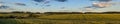 beautiful evening summer rural landscape. scenic panoramic view of a wide hilly agricultural field in the warm light of sunset Royalty Free Stock Photo