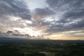 Beautiful evening sun gray clouds covered with green forest, Sky background Royalty Free Stock Photo