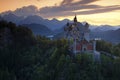 Beautiful evening view of the fairy tale Neuschwanstein castle, with autumn colours during sunset, Bavarian Alps, Bavaria, Germany Royalty Free Stock Photo