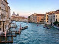 A beautiful evening view of the Grand Canal in Venice, Italy with water taxis and gondolas past by and the Santa Maria Della Salut