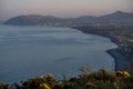 Beautiful evening view of Killiney Beach, Bray Head, Little Sugar Loaf and gorse Ulex flowers seen from Killiney Hill, Dublin Royalty Free Stock Photo