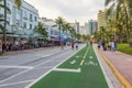 Beautiful evening view at sunset on Ocean Drive, where people stroll along restaurants and park. Miami Beach.