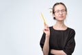 Woman in eyeglasses in black dress giving advice having a good idea