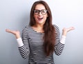 Beautiful excited woman in glasses with natural surprising emotions gesturing the hands Royalty Free Stock Photo