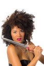 Beautiful exotic young tribal woman holding a dagger Royalty Free Stock Photo