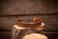 Beautiful expensive gold bracelets on wooden Royalty Free Stock Photo