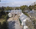 Beautiful, expensive large home on wooded waterfront lot, aerial view Royalty Free Stock Photo