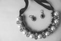 Beautiful expensive precious shiny jewelry fashionable glamorous jewelry, necklace and earrings with pearls and diamonds