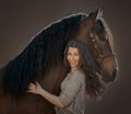 Beautiful expression young woman portrait with spanish horse Royalty Free Stock Photo