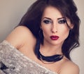 Beautiful expressive make-up woman with red lips posing in with