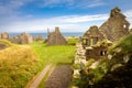 Beautiful Exterior of Dunnottar Castle with blue sky and green grass, near Stonehaven, Aberdeenshire, Scotland, UK Royalty Free Stock Photo