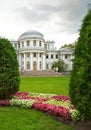 Beautiful exterior of Elagin Summer Palace and flower beds in Elagin park