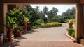 A beautiful and eye pleasing driveway tasetfully landscaped for arrival to the drop-off area