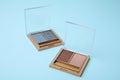 Beautiful eye shadow palettes on light blue background