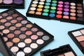 Beautiful eye shadow palettes on light blue background