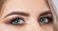 Beautiful eyes of a woman with bright make-up close-up. makeup and healthy clean skin. Professional makeup concept