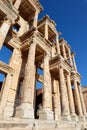 Beautiful facade with columns of Library of Celsus in archaeological site Ephesus in Turkey under clear blue sky