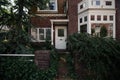 Beautiful facade of the house in thickets of bushes. Royalty Free Stock Photo