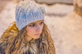 Beautiful Face closeup of Young Woman .Blond girl.Snow in background