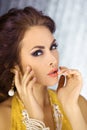 Beautiful face of a glamour woman with smoky eyes make-up. Beauty portrait young girl.