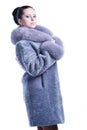 Beautiful woman in bluish winter mink coat