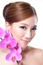 Beautiful face with pink orchids Royalty Free Stock Photo