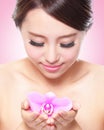 Beautiful face with pink orchids Royalty Free Stock Photo